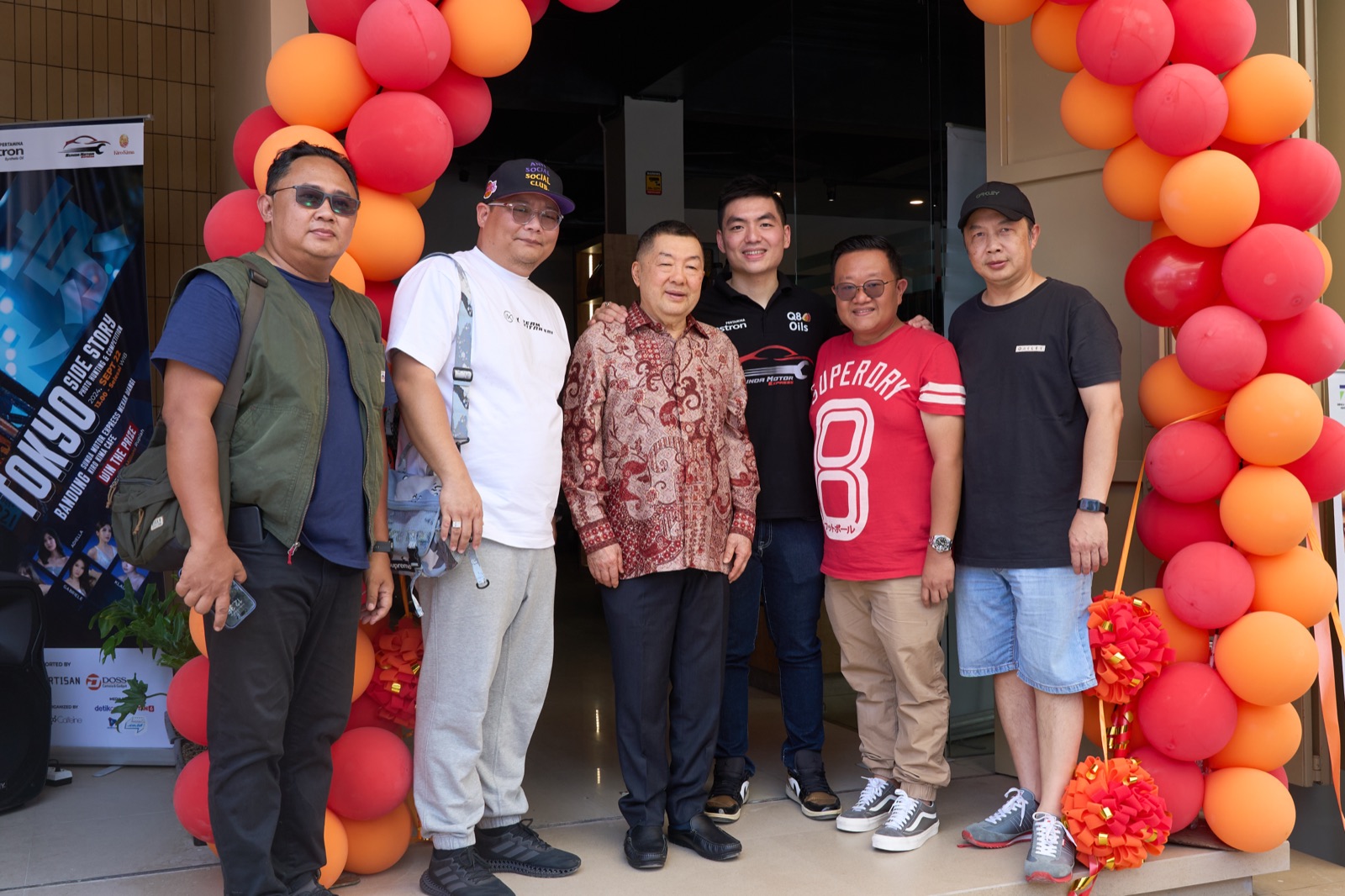 The owners pose for a photo to mark the official opening of Sunda Motor Express Bandung