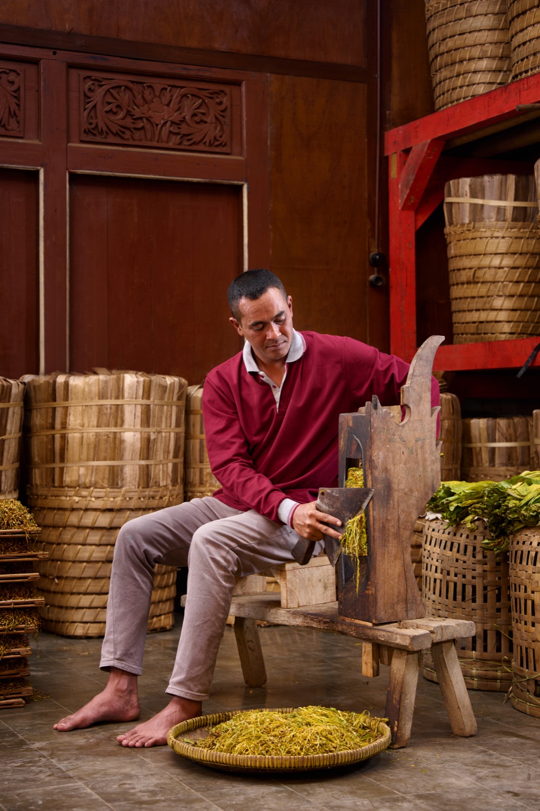 the traditional hand-cutting of tobacco leaves