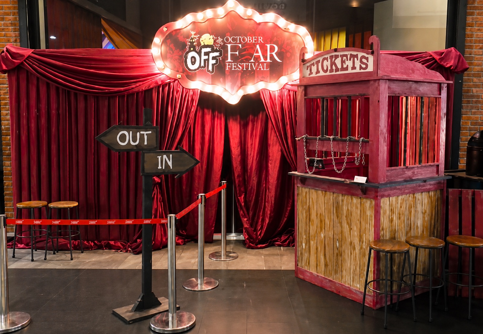 The entrance gate was crafted to resemble an old, abandoned ticket booth, creating a creepy first encounter before guests entered the main event area.