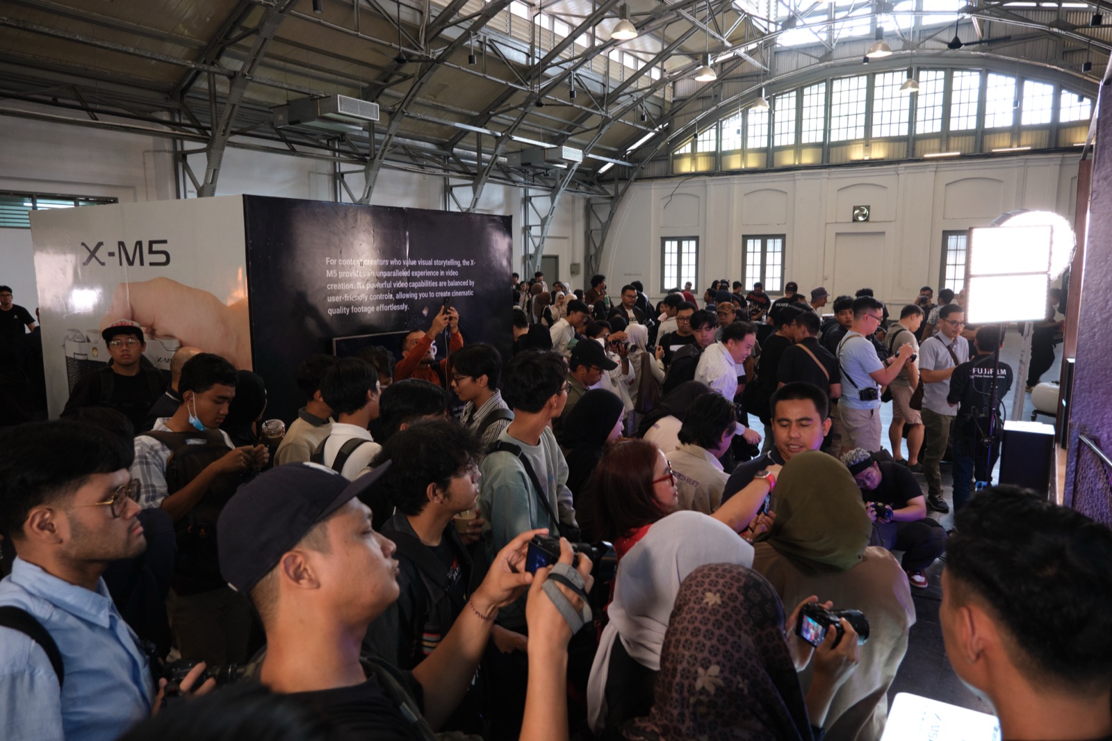 Guests exploring the X-M5 at the experience zone.